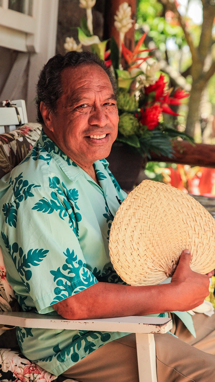 Older man in a chair.