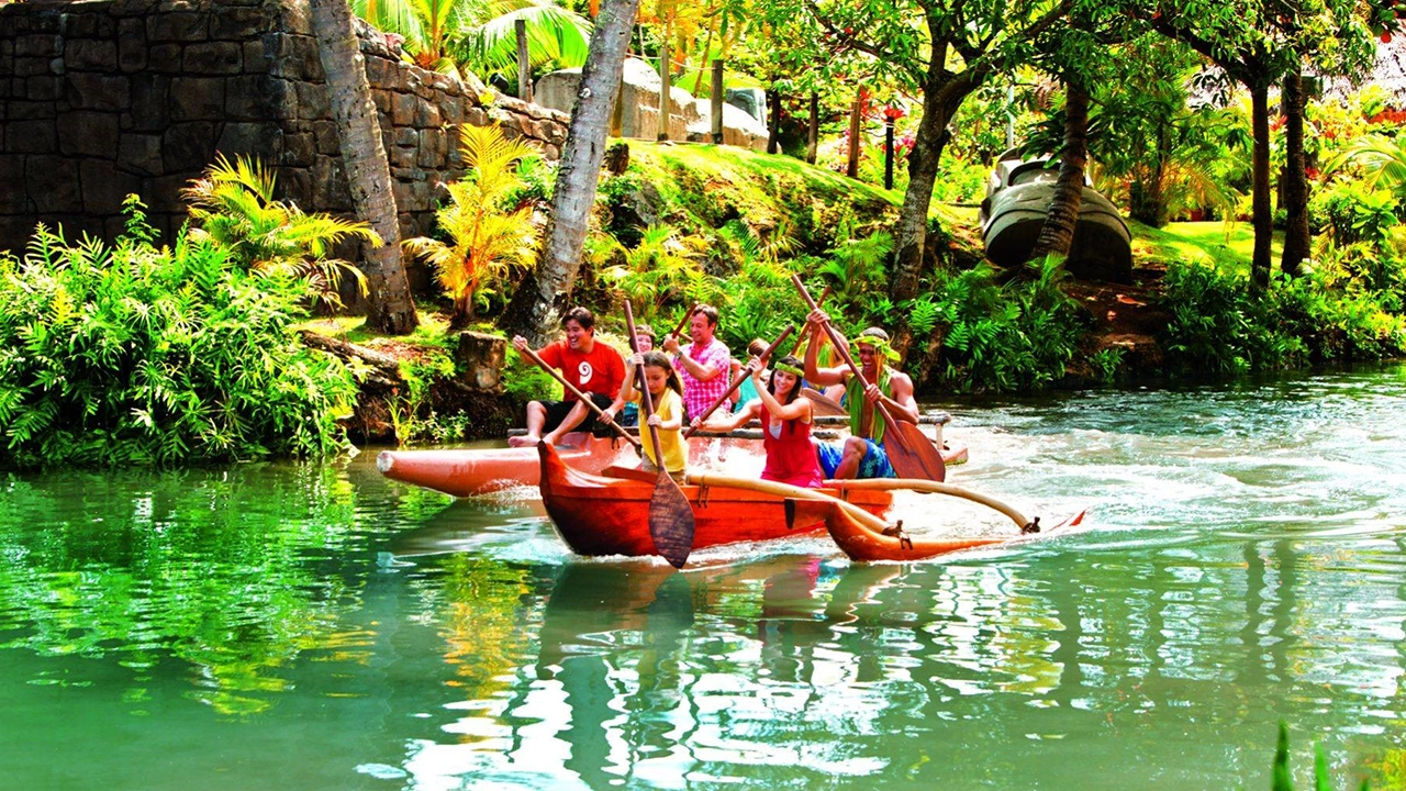 Visitors paddle canoes around lagoon at PCC