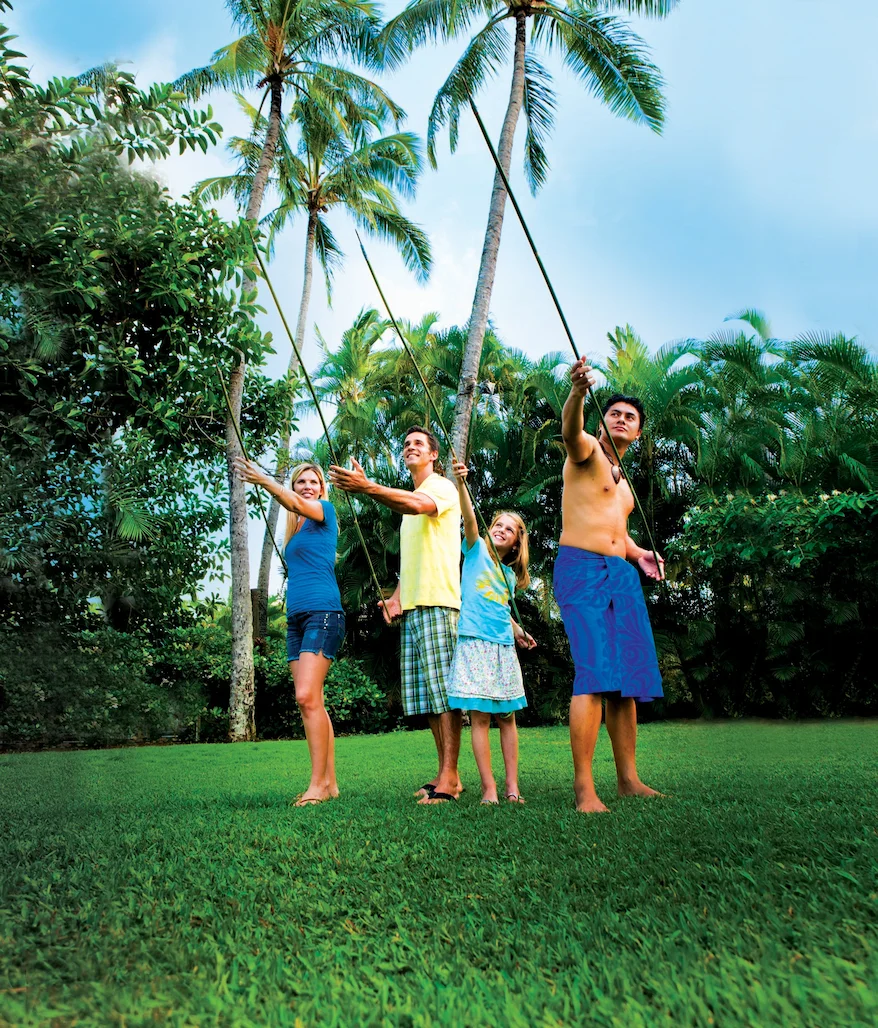 Family participating in the Tongan spear throwing activity.