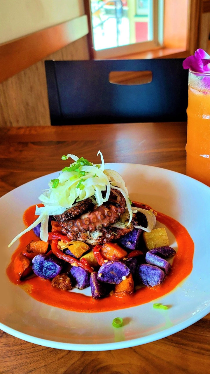 Octopus served on Okinawan sweet potatoes.