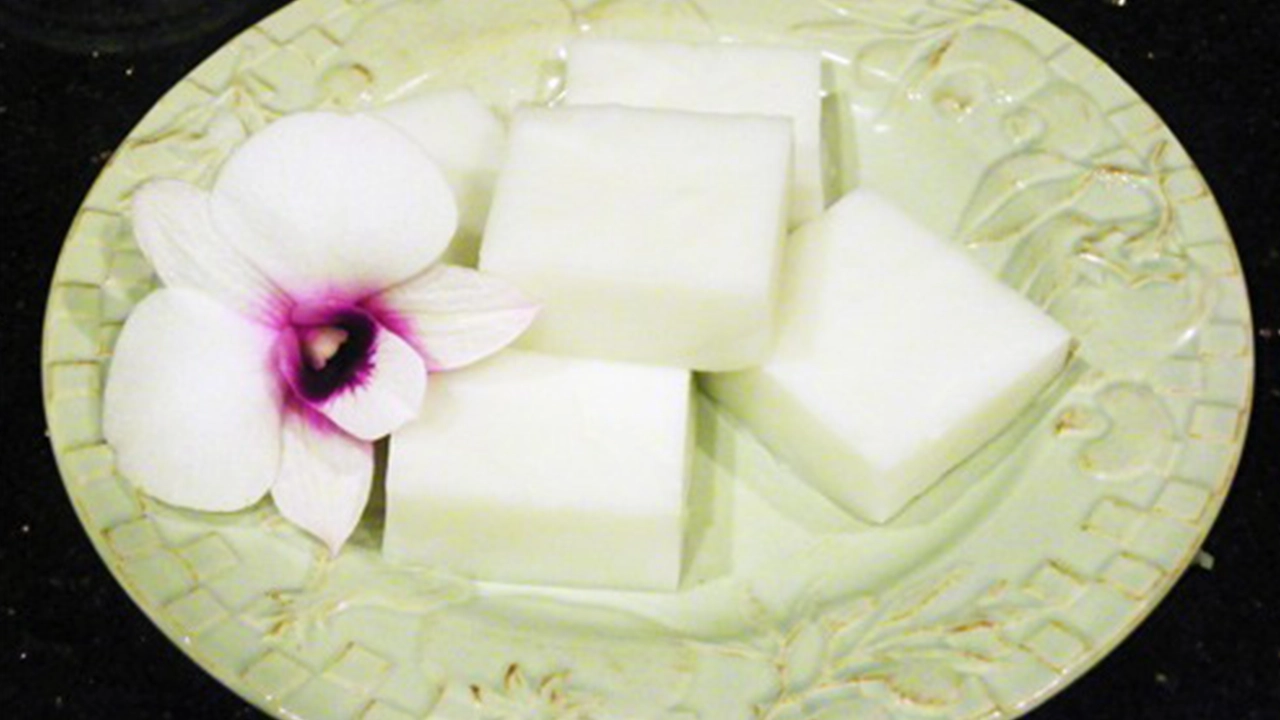 Haupia cubes served with a flower.