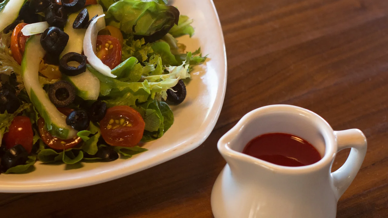 A summer salad presented with Li Hing Mui vinaigrette dressing.