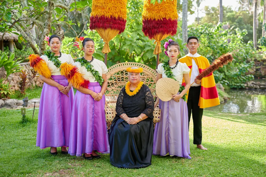 Portrayal of Queen Liliʻuokalani with beautiful performers at Aliʻi Lūʻau in Polynesian Cultural Center.
