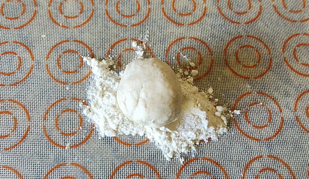 Paifala pastry rolled into ball of dough.