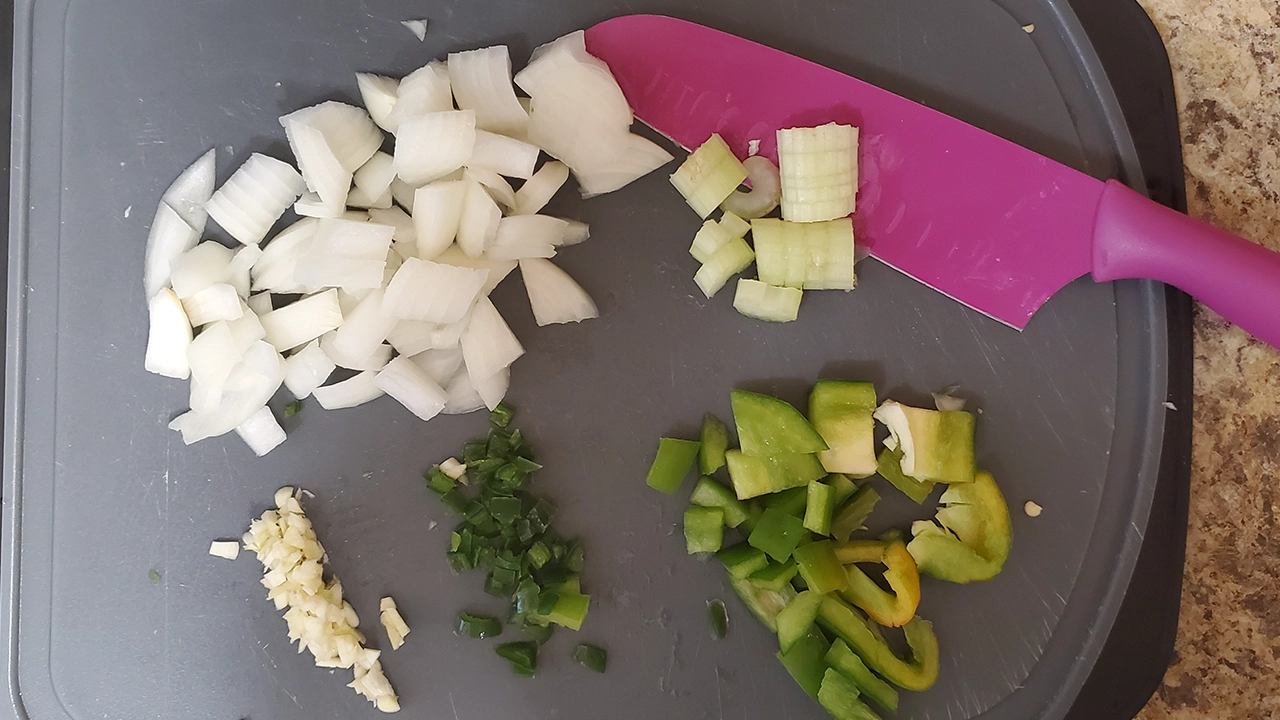 Alternate ingredients for chicken or vegetarian roti including onions, celery, sweet peppers, cilantro, and crushed and diced ginger.