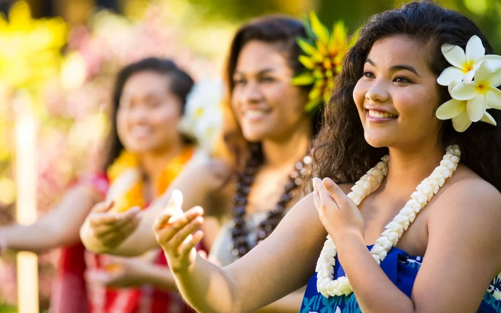 Beautiful Hawaiian women showcasing the Hawaiian word pono with their smiles