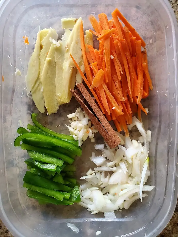 cut and sliced ginger, carrots, onions, and bell pepper