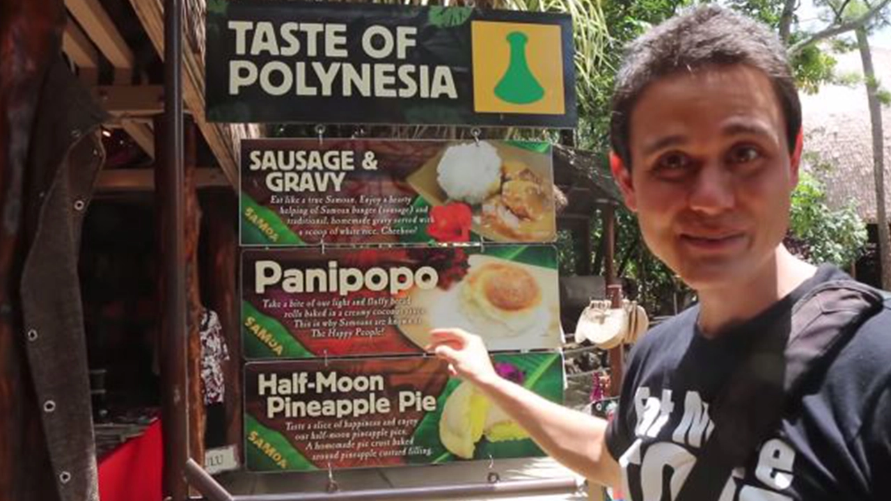 Mark Wiens showing the different foods available at the Polynesian Cultural Center.