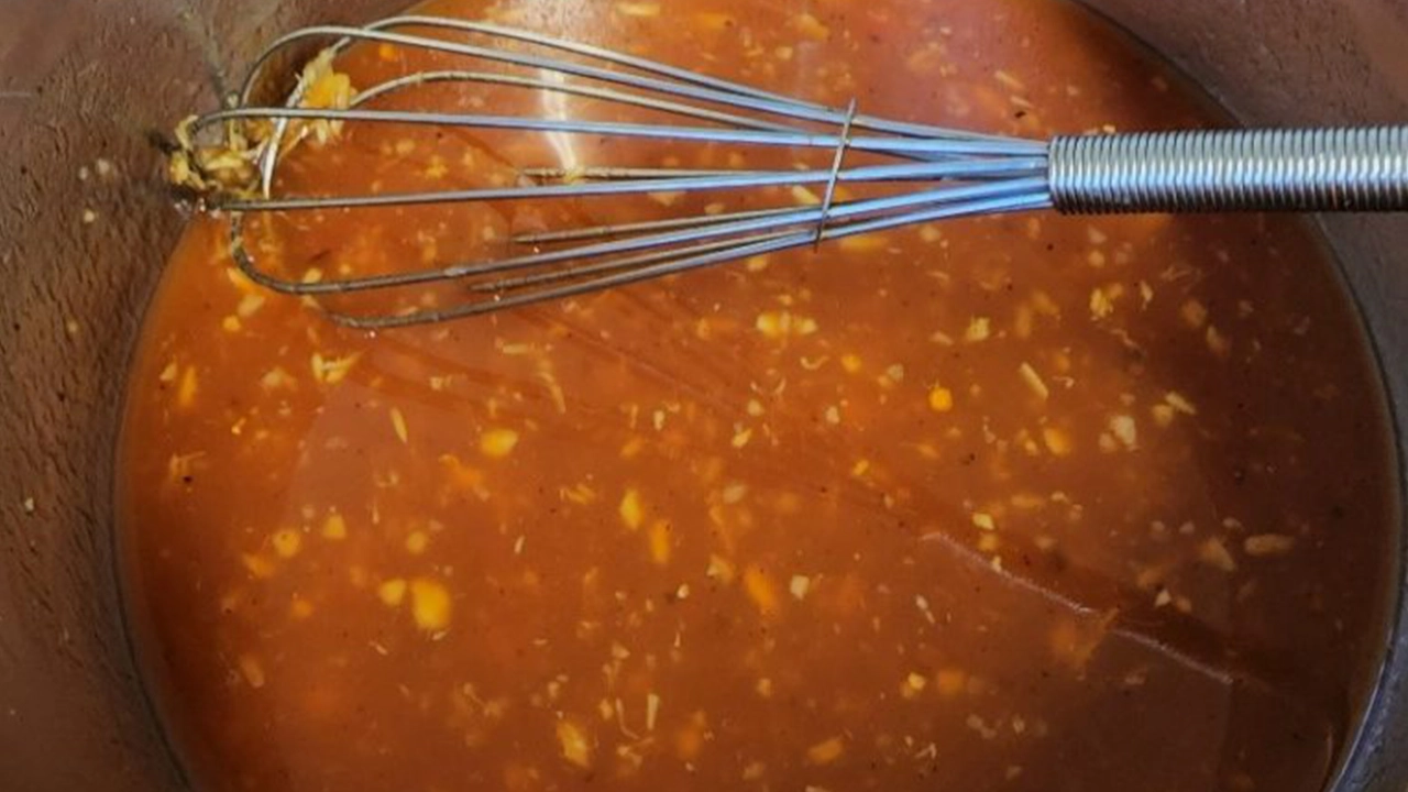 Simmering Huli Huli Chicken sauce in a pan