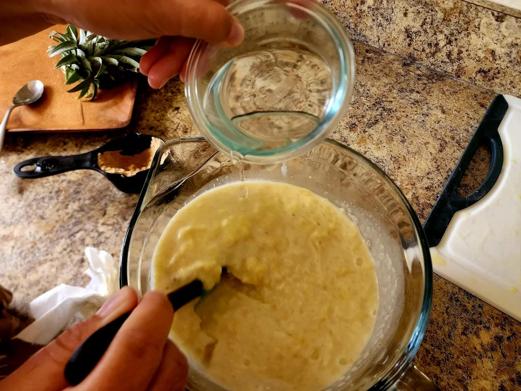 A half cup of water added to the mixture. Halfway through to make vaifala.