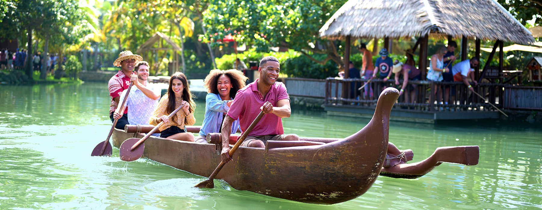 Family paddling a canoe together on a canoe tour.