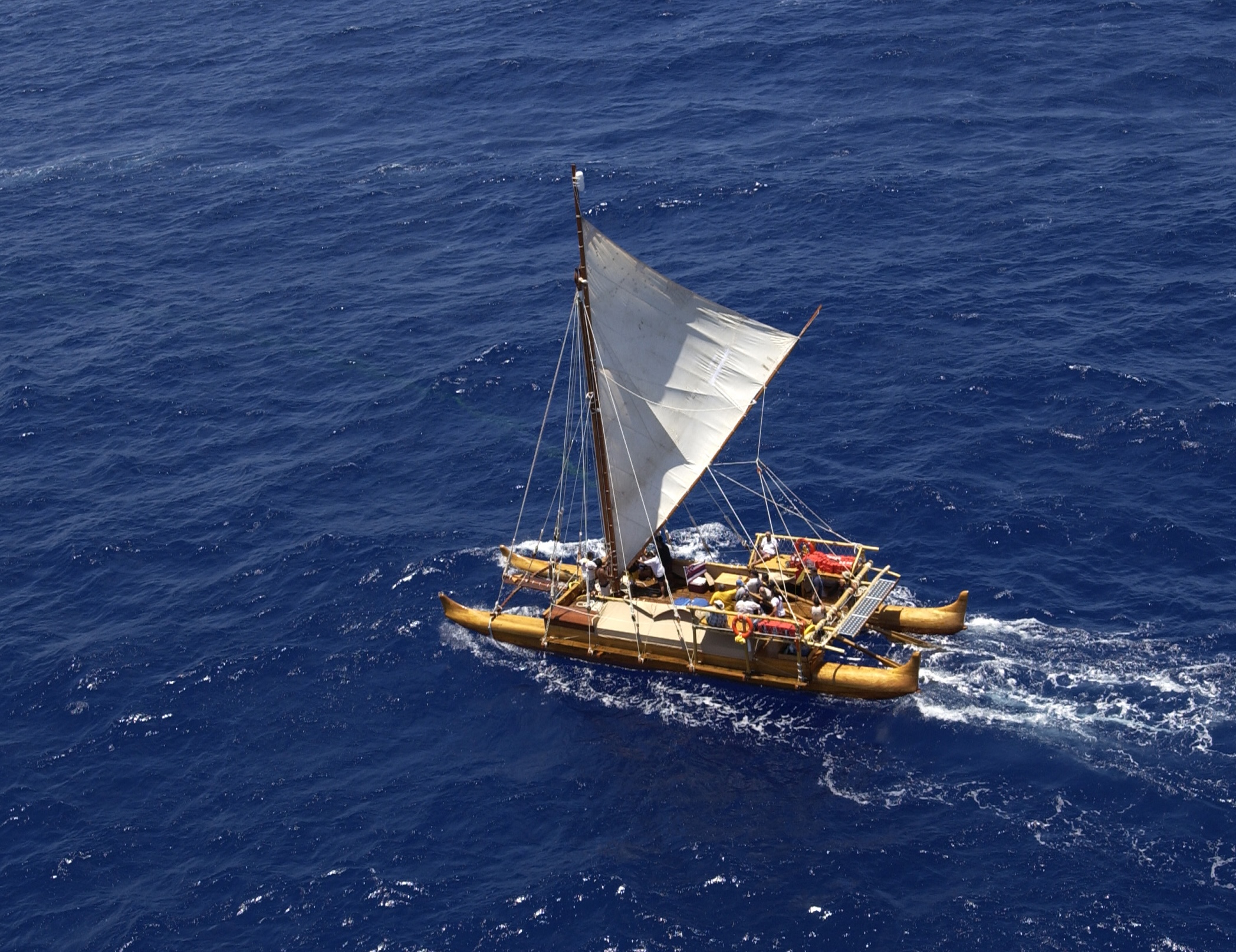 The Iosepa, a traditional double-hulled, canoe sailing in the ocean.