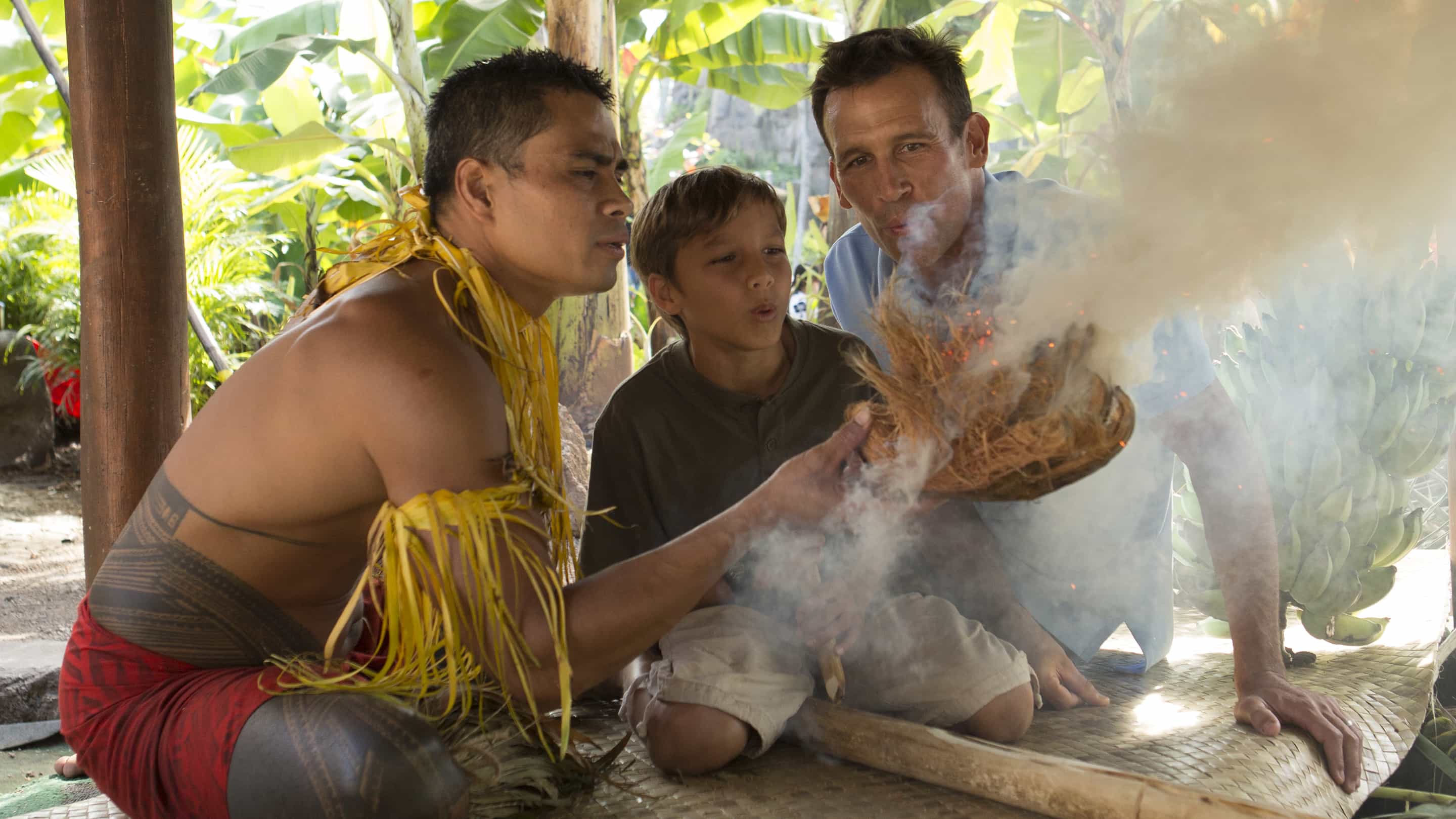 Hands-on activity where guests make fire with sticks in Samoa village at the Polynesian Cultural Center.